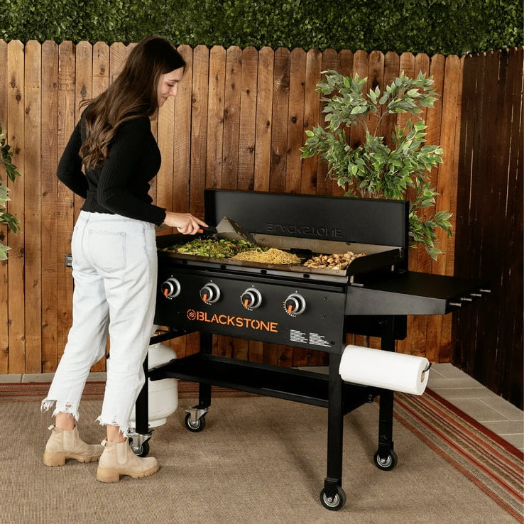 Lady cooking on the Blackstone 36 inch griddle