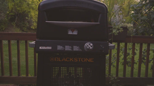 Lifestyle video showing family cooking and eating pizza around the Blackstone Pizza Oven